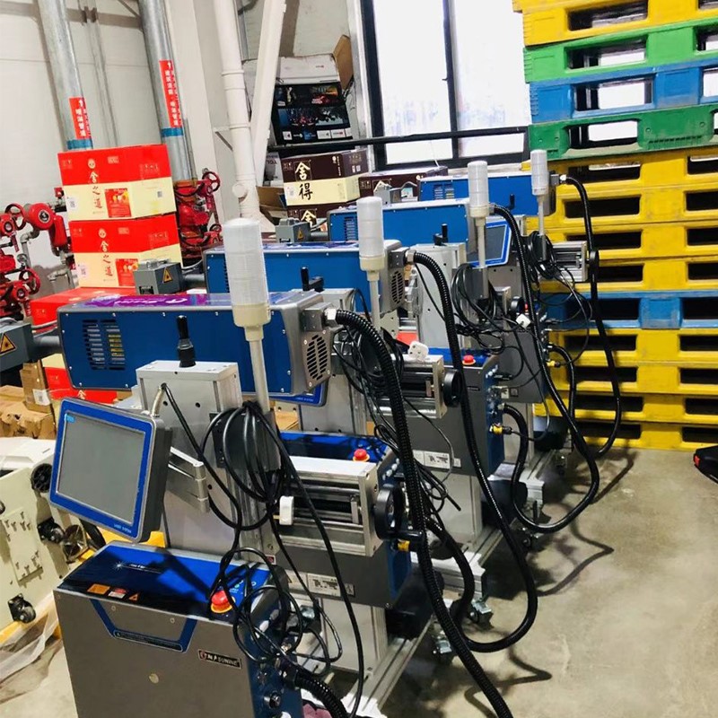 CO2 laser printer on the conveyor belt CO2 laser printer on the conveyor belt
